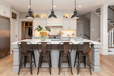 Kitchen - transitional kitchen idea in Other with an undermount sink, marble countertops, white backsplash, marble backsplash and stainless steel appliances