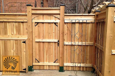 Inspiration for a mid-sized timeless backyard patio remodel in Toronto with decking and a pergola