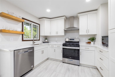 Inspiration for a mid-sized transitional u-shaped vinyl floor and beige floor eat-in kitchen remodel in Minneapolis with a single-bowl sink, shaker cabinets, white cabinets, quartz countertops, gray backsplash, quartz backsplash, stainless steel appliances, an island and white countertops