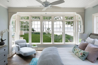 Inspiration for a large coastal master medium tone wood floor bedroom remodel in Minneapolis