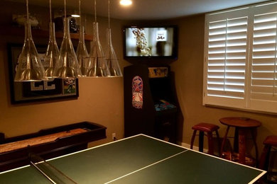Inspiration for a timeless game room remodel in Denver with beige walls and a corner tv