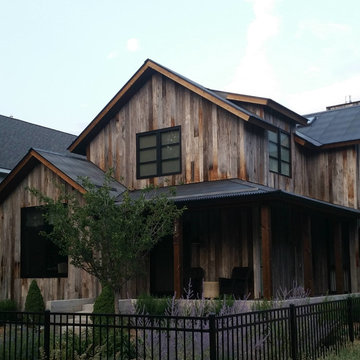 Vertical wood siding with modern metal roof