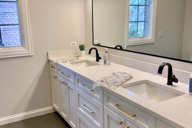 Inspiration for a mid-sized transitional kids' white tile and ceramic tile porcelain tile, gray floor, double-sink and vaulted ceiling bathroom remodel in Chicago with white cabinets, an undermount sink, quartz countertops, white countertops and a built-in vanity