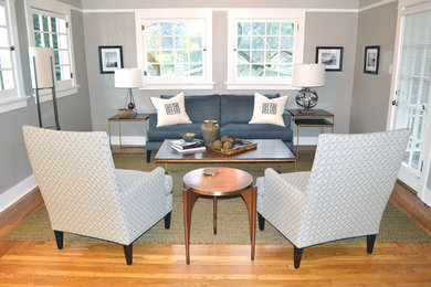 Inspiration for a mid-sized transitional freestanding desk medium tone wood floor study room remodel in San Francisco with gray walls