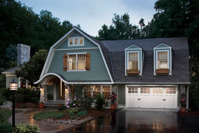 Large cottage green three-story concrete fiberboard house exterior photo in Edmonton with a gambrel roof and a shingle roof