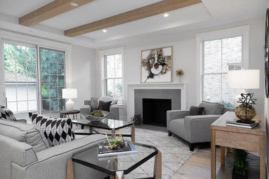 Inspiration for a large farmhouse open concept light wood floor and beige floor living room remodel in Chicago with white walls, a standard fireplace and a stone fireplace
