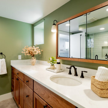 Modern Basement Vanity with Undermount Sink and Sage Green Accent Wall