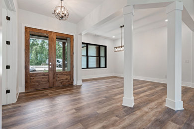 Example of a large farmhouse entryway design in Atlanta