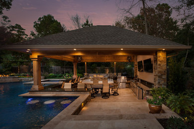Photo of a transitional garden in Houston with natural stone pavers.