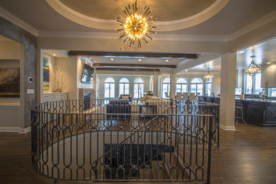 Inspiration for a mid-sized transitional wooden metal railing staircase remodel in Milwaukee with painted risers