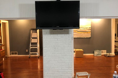 Inspiration for a living room remodel in Atlanta with a wall-mounted tv