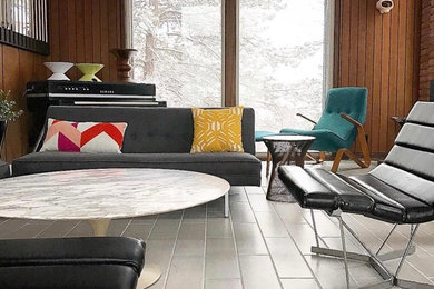 Living room - mid-sized 1950s formal and open concept porcelain tile and gray floor living room idea in Salt Lake City with brown walls, no fireplace and no tv