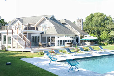 Inspiration for a mid-sized timeless gray one-story wood exterior home remodel in New York with a shingle roof