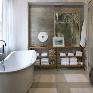 Example of a huge coastal master metal tile beige floor bathroom design in Atlanta with white walls, furniture-like cabinets and medium tone wood cabinets