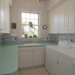 This is an example of a medium sized classic u-shaped separated utility room in Tampa with a built-in sink, recessed-panel cabinets, white cabinets, laminate countertops, white walls, ceramic flooring, a side by side washer and dryer and turquoise worktops.