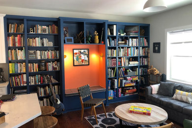 Mid-sized transitional open concept family room library photo in New York