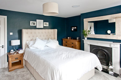 This is an example of a contemporary bedroom in Surrey.