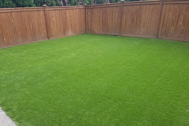 Photo of a mid-sized traditional partial sun backyard landscaping in Seattle.