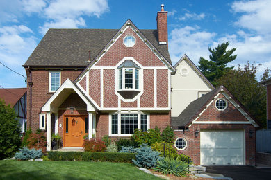 Inspiration for a large timeless three-story exterior home remodel in Toronto