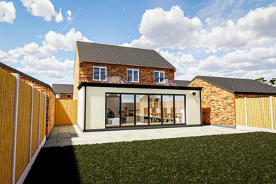 Imagen de fachada de casa beige y gris contemporánea de tamaño medio de dos plantas con revestimiento de estuco, tejado a dos aguas y tejado de teja de barro