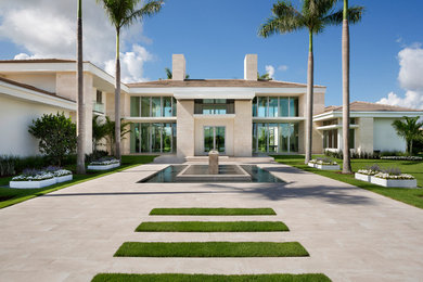 Inspiration for a huge contemporary beige two-story concrete house exterior remodel in Other