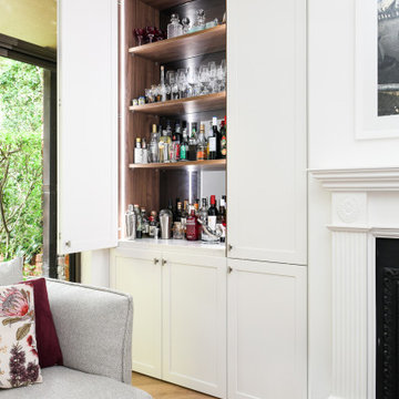 White Shaker Cabinets with Bar and Library