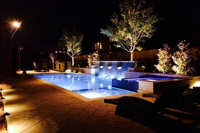 Inspiration for a large modern backyard tile and rectangular lap hot tub remodel in Dallas