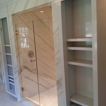 Linen closets beside walk in shower