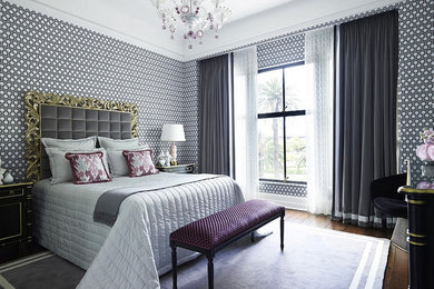 Inspiration for a mid-sized contemporary guest dark wood floor and brown floor bedroom remodel in Phoenix with multicolored walls and no fireplace