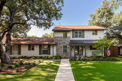 Mid-sized elegant white two-story brick exterior home photo in Dallas with a hip roof