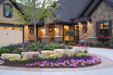 Inspiration for a large timeless brown one-story stone gable roof remodel in Minneapolis