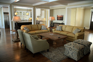 Living room - large contemporary formal and open concept dark wood floor living room idea in Other with beige walls, a standard fireplace, a brick fireplace and no tv