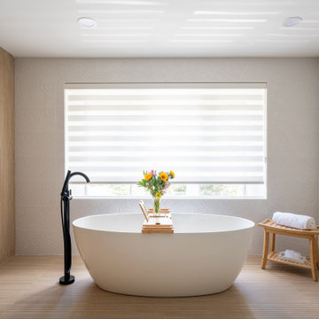 Zen Bathroom Remodel with Floating Vanity and Freestanding Tub