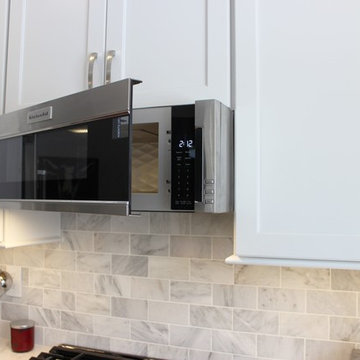 Moline Kitchen With Bright White Cabinets and Cambria Britannica Quartz