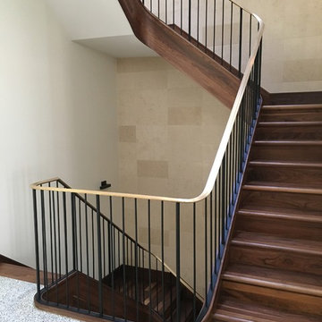 Walnut Stairs with Bronze Handrail and Iron Balusters