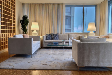Inspiration for a large modern open concept medium tone wood floor and brown floor living room remodel in Chicago with beige walls