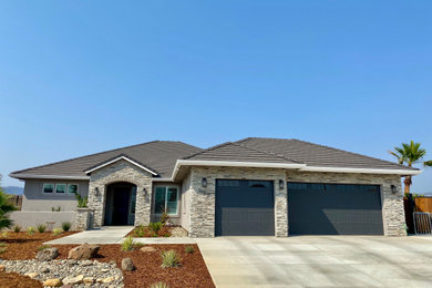 Inspiration for a gray one-story mixed siding house exterior remodel in Other with a hip roof and a tile roof