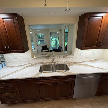Seamless Style With Cinnamon Cabinets & Quartz Countertops
