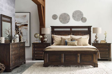 Example of a large transitional master concrete floor and gray floor bedroom design in San Luis Obispo with white walls and no fireplace
