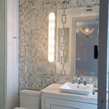 Contemporary powder room with opal metallic glass mosaic walls