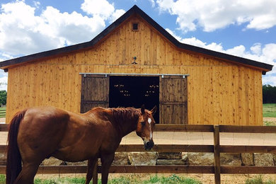 Inspiration for a mid-sized rustic brown one-story wood gable roof remodel in Austin