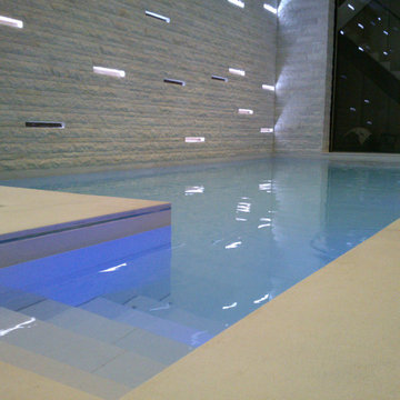 Indoor pool with aquatic floor retracted