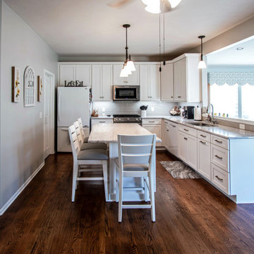 White Shaker Kitchen w/ Pietra Quartz Countertop and Gray Subway Tile Backsplash