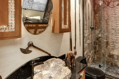 Eclectic alcove shower photo in New York with a one-piece toilet, beige walls, a vessel sink, a hinged shower door and blue countertops