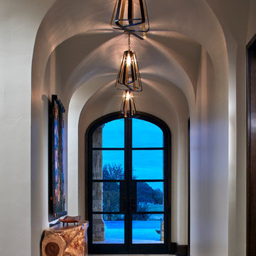 Groin Vault Ceiling with Open-Shade Light Fixtures and Natural Wood Console