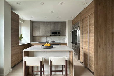 Eat-in kitchen - small modern u-shaped eat-in kitchen idea in New York with flat-panel cabinets and an island