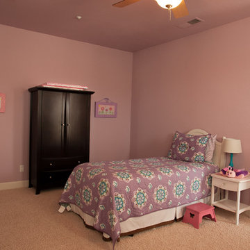 Interior remodel including flooring, stone wall, and lighting.
