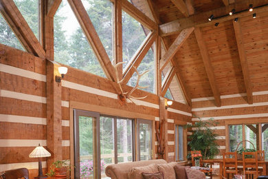 Mid-sized mountain style open concept medium tone wood floor living room photo in Charlotte