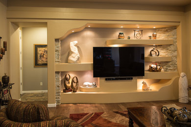 Mid-sized southwest formal and enclosed dark wood floor and brown floor living room photo in Phoenix with beige walls, no fireplace and a wall-mounted tv