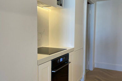 This is an example of a modern kitchen in Sydney with marble benchtops.